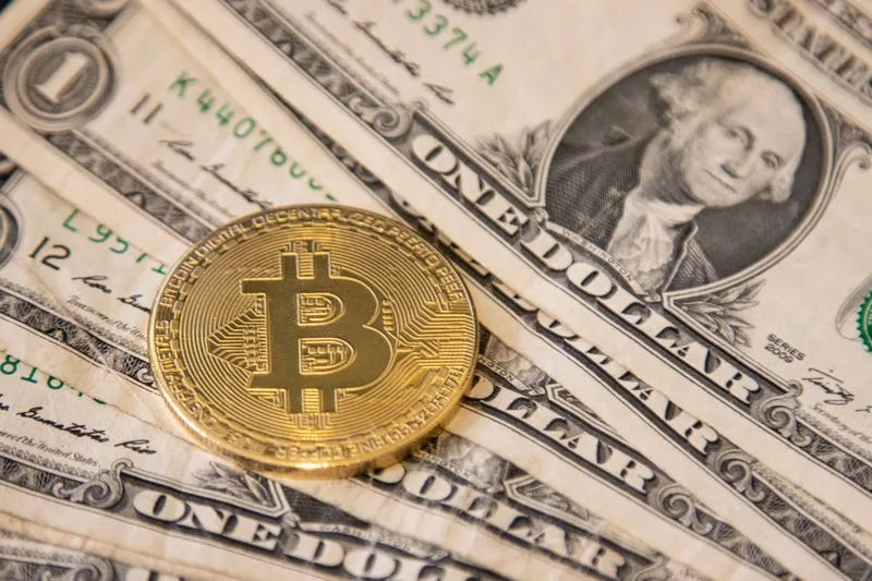 Bitcoin tumbles to less than $100,000 as a strong U.S. dollar hits crypto